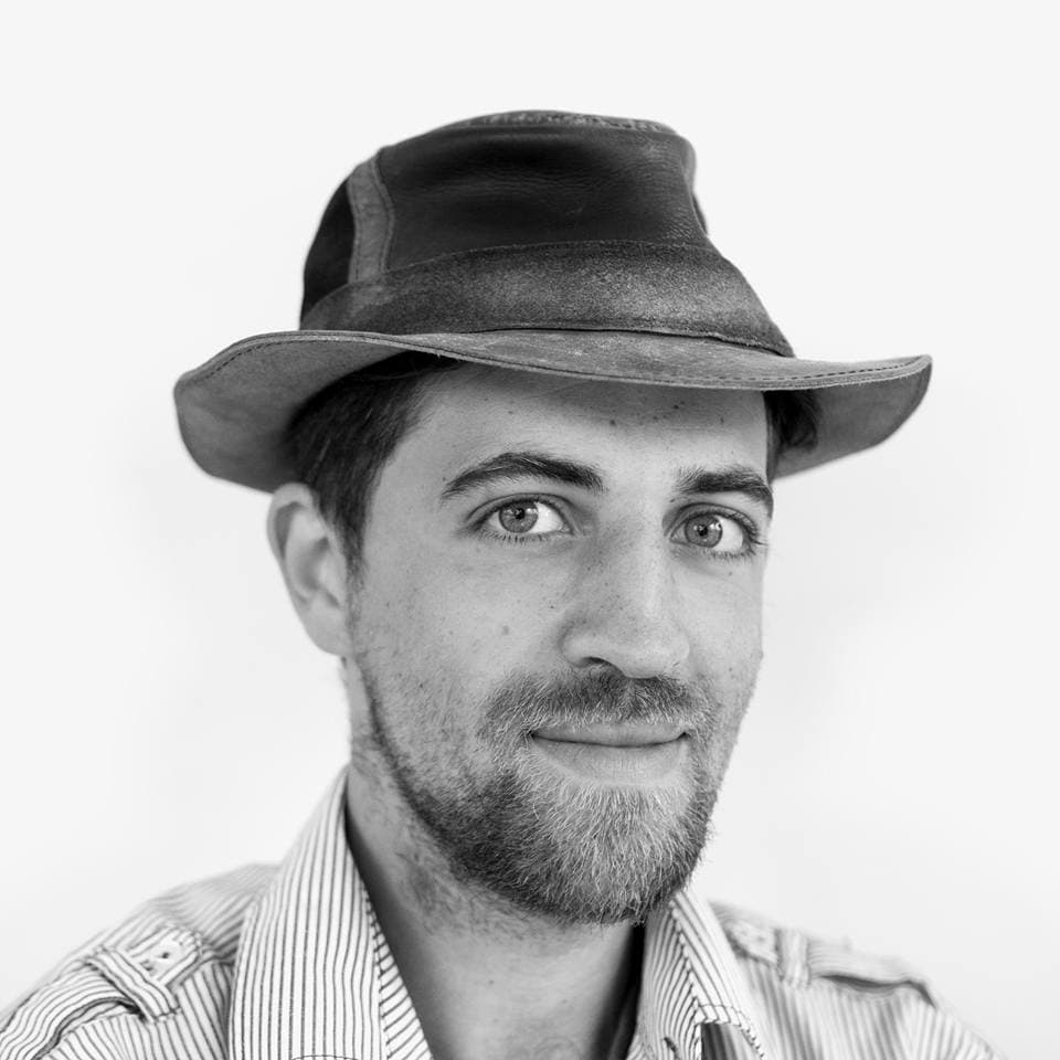 Black-and-white portrait of Nabil Chaib Draa wearing a hat.